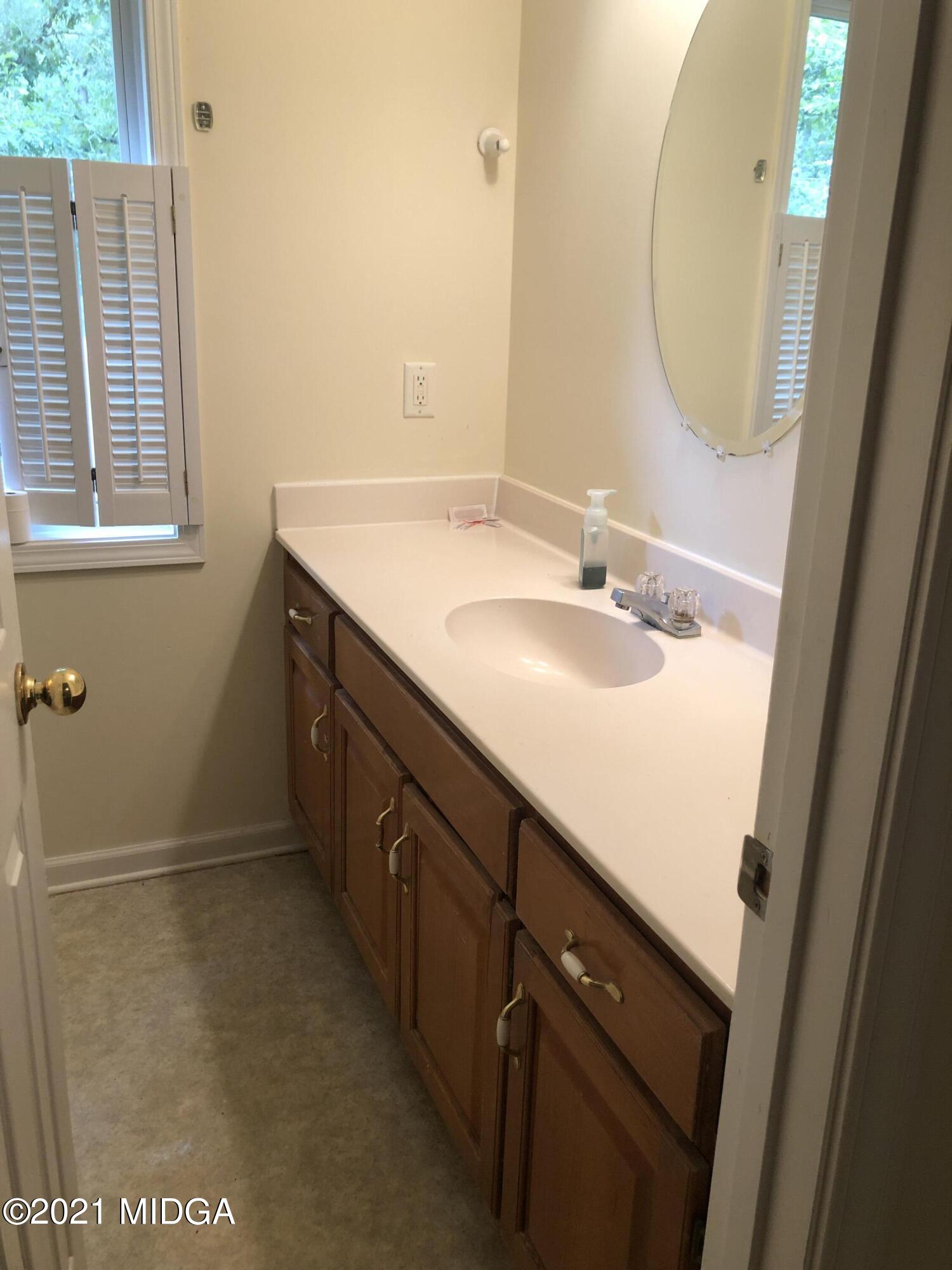 339 Wheeler Road Gray, GA 31032 - Photo 6 of 11 a bathroom with a double vanity sink and a mirror