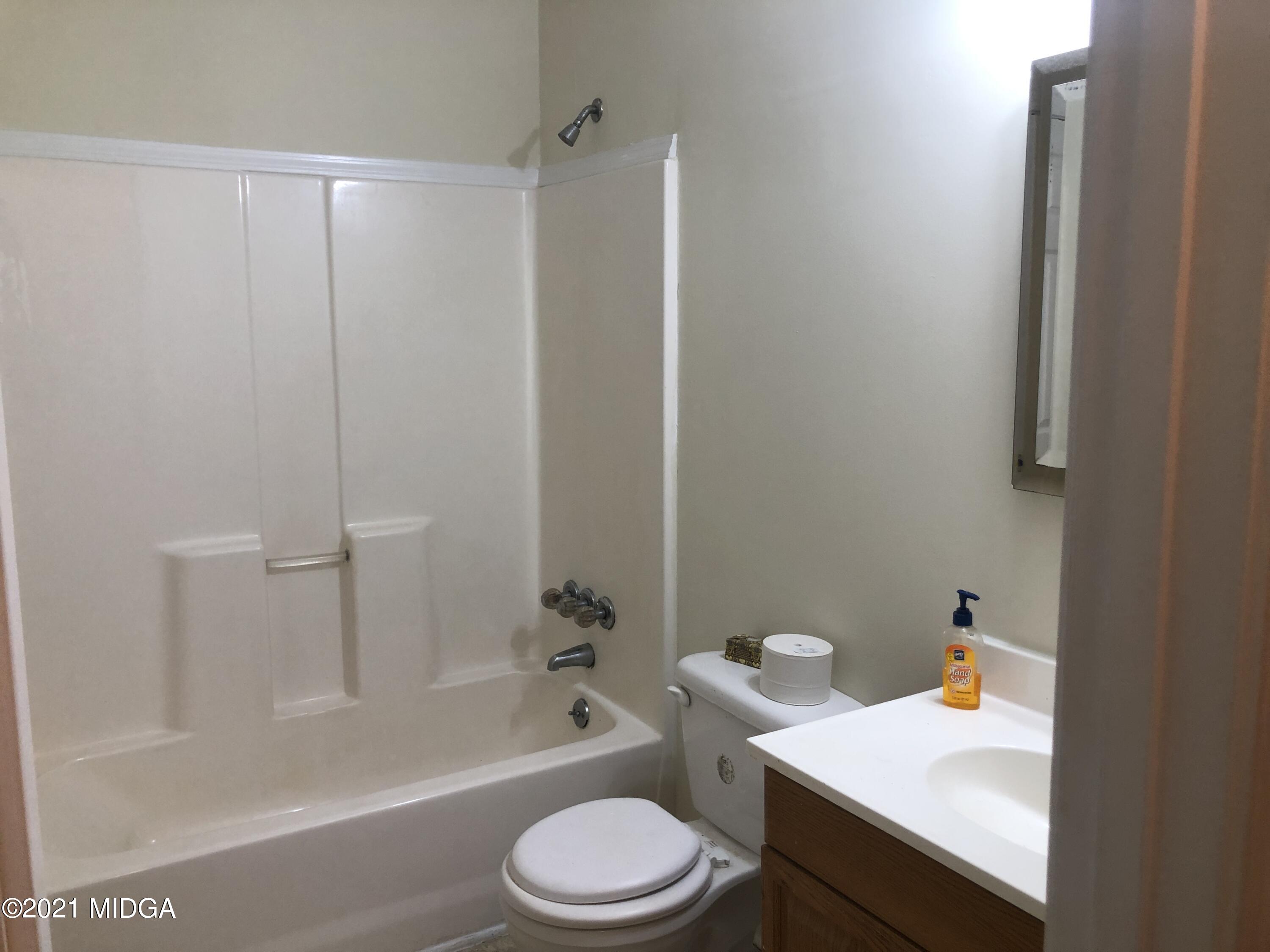 339 Wheeler Road Gray, GA 31032 - Photo 7 of 11 a bathroom with a sink toilet and shower