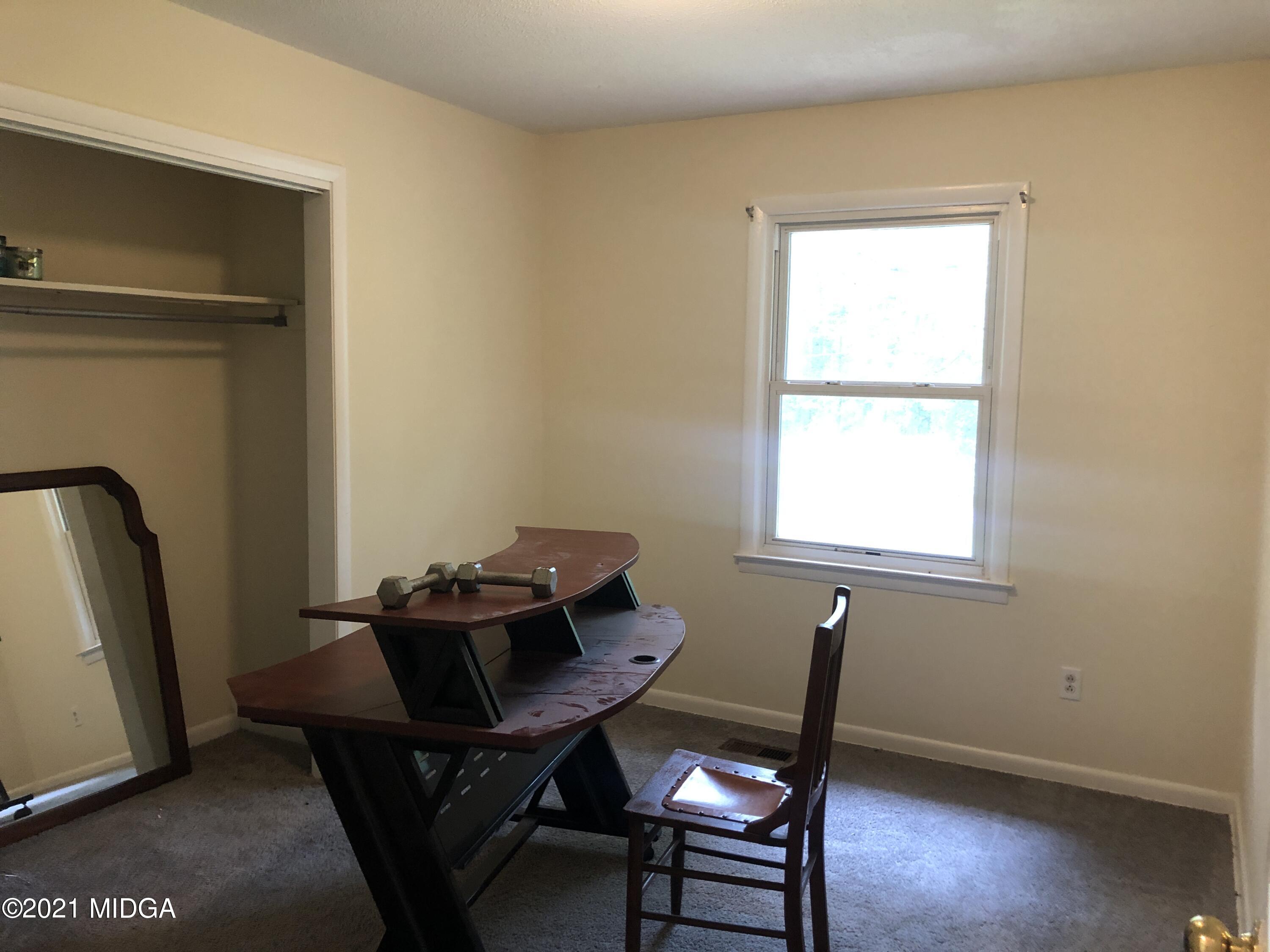 339 Wheeler Road Gray, GA 31032 - Photo 8 of 11 a view of a workspace with furniture and a window