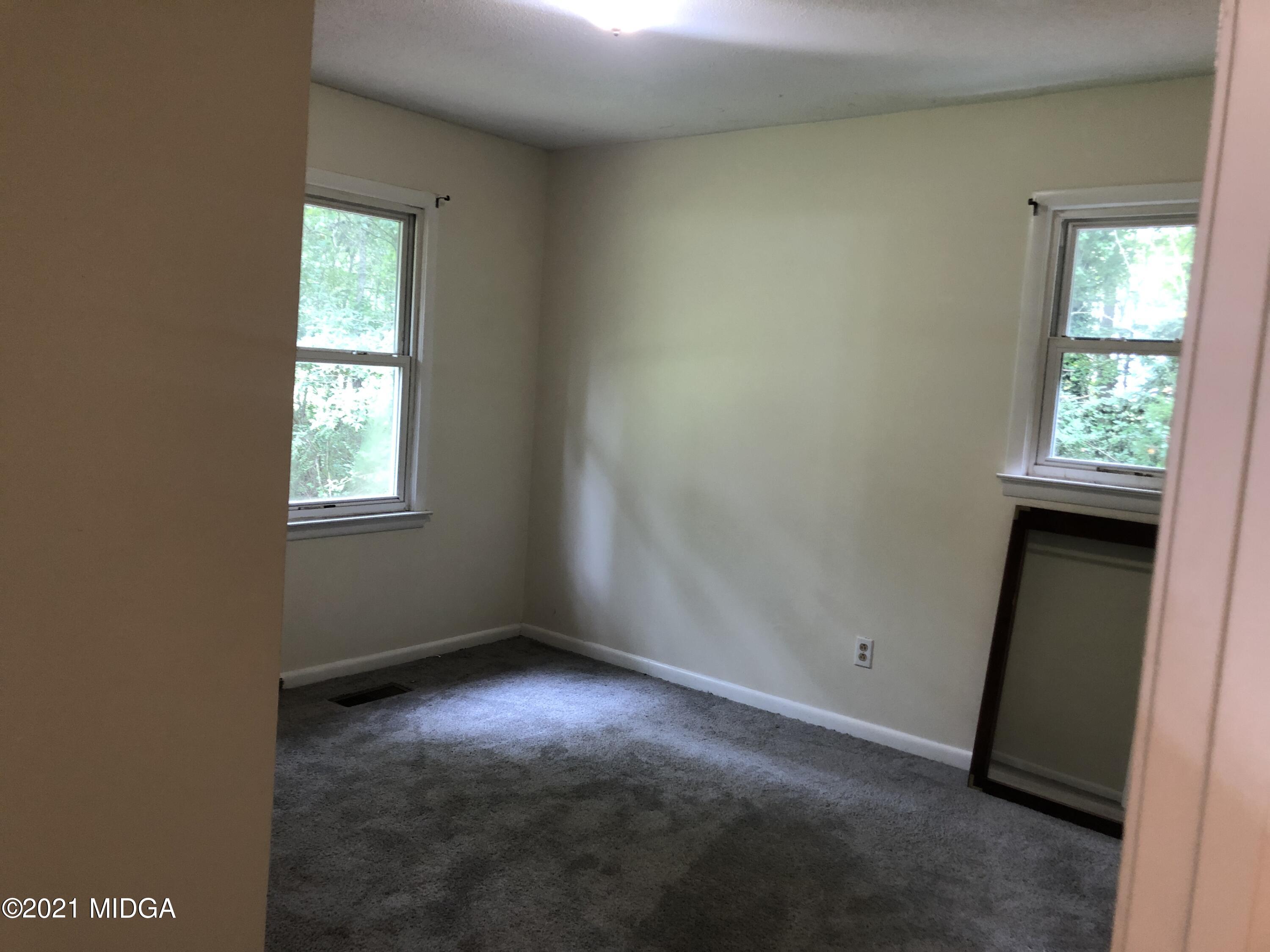 339 Wheeler Road Gray, GA 31032 - Photo 9 of 11 an empty room with windows