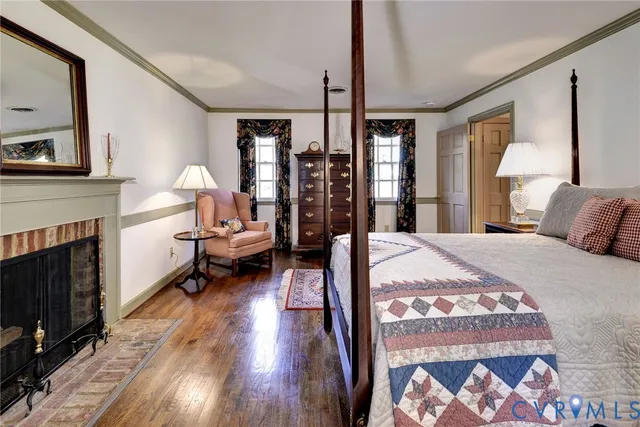 a bed room with a bed furniture and a fireplace