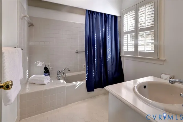 a bathroom with a sink and a bathtub