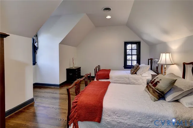 a bed room with a bed and a night stand