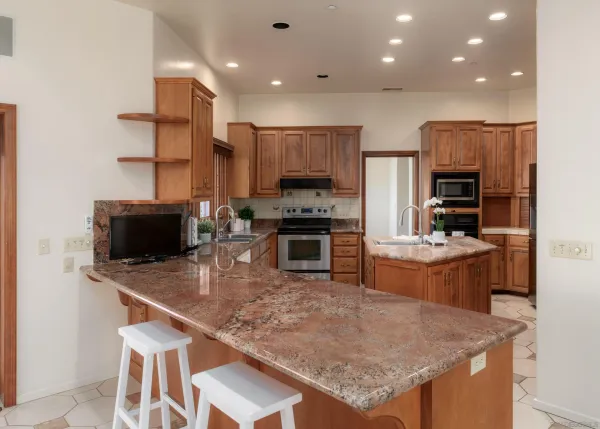 a view of a dining room with furniture large window and garden