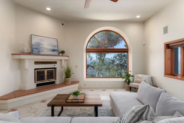 a large kitchen with a lot of counter space and a wooden floor