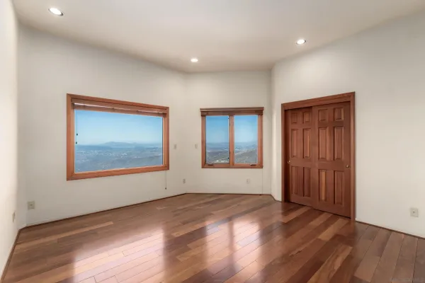 a view of a refrigerator and window in a room