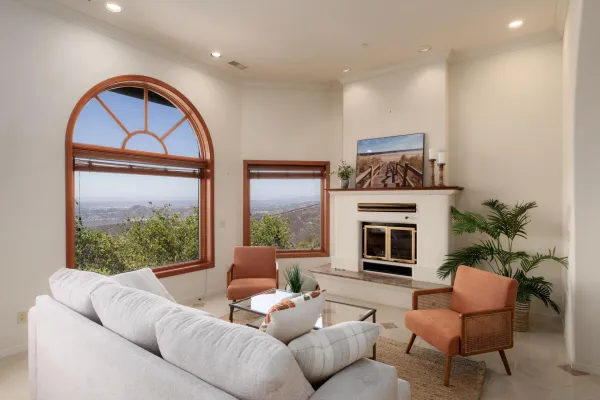 a living room with furniture and a large window