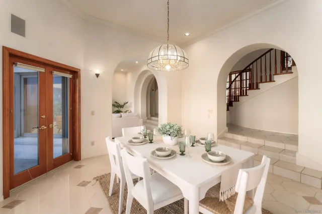 a kitchen with stainless steel appliances granite countertop a sink refrigerator and cabinets