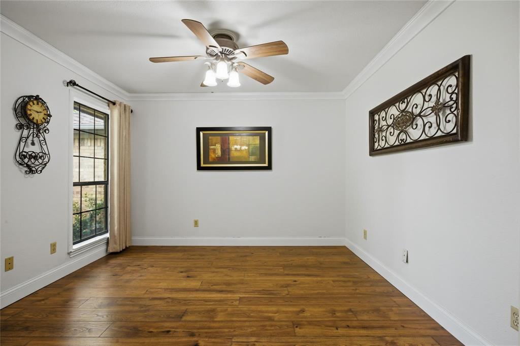 265 East Dove Road Southlake, TX 76092 - Photo 6 of 39 a view of an empty room with window and wooden floor