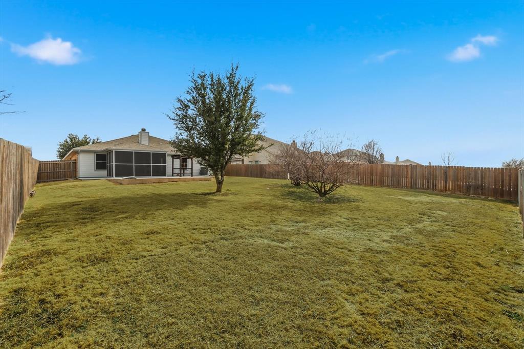 205 Broken Arrow Lane Krum, TX 76249 - Photo 27 of 28 a view of a house with a yard