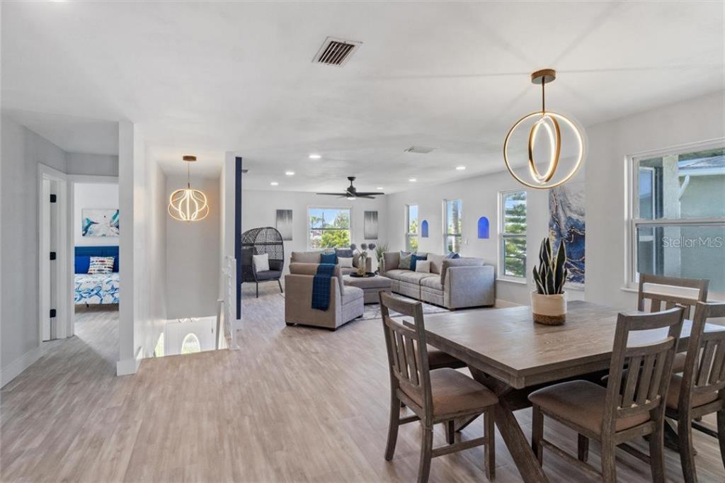 307 161st Avenue Redington Beach, FL 33708 - Photo 13 of 41 a view of a dining room with furniture and wooden floor