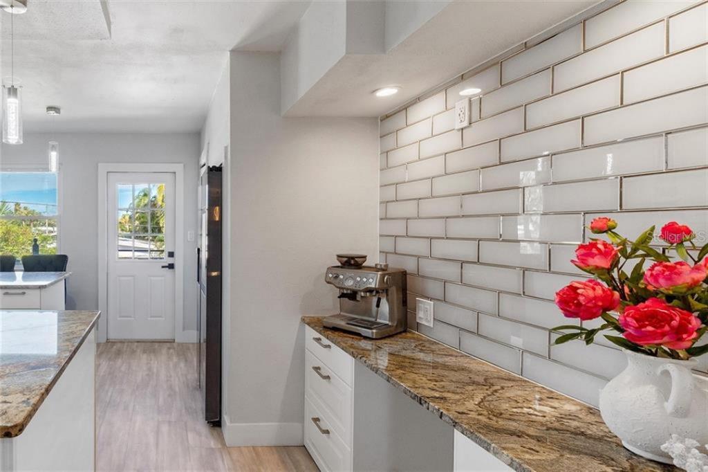 307 161st Avenue Redington Beach, FL 33708 - Photo 18 of 41 a kitchen with a sink and cabinets