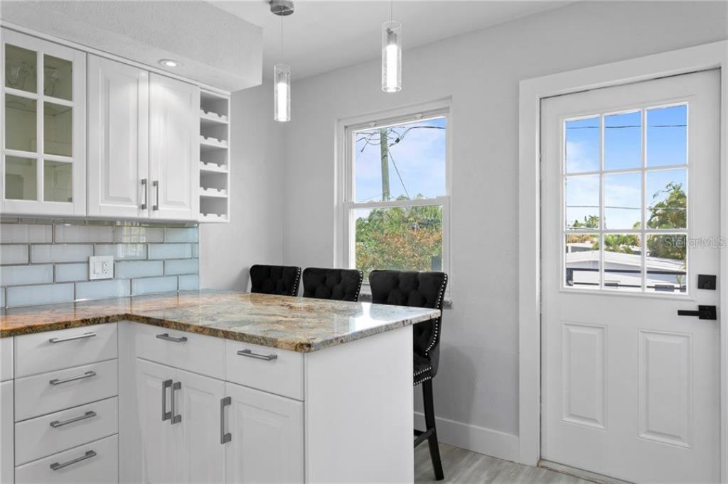 307 161st Avenue Redington Beach, FL 33708 - Photo 19 of 41 a kitchen with a sink cabinets and window