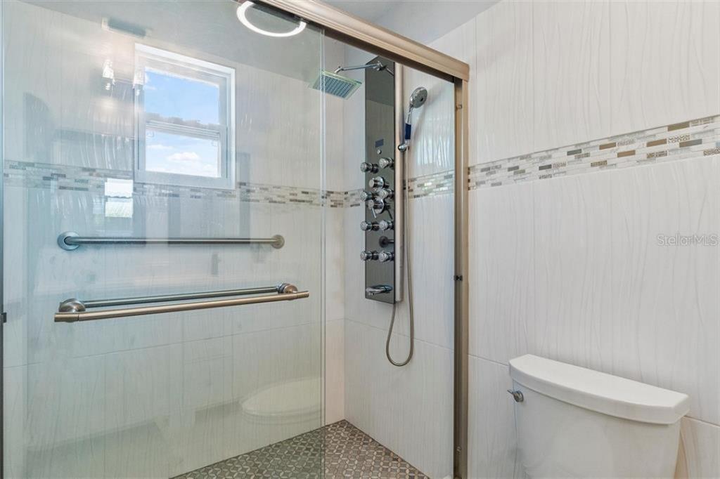 307 161st Avenue Redington Beach, FL 33708 - Photo 22 of 41 a bathroom with a shower and toilet