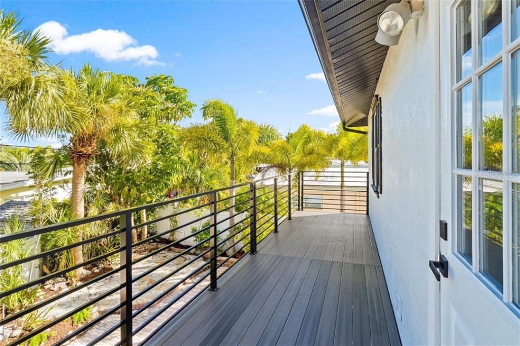 307 161st Avenue Redington Beach, FL 33708 - Photo 27 of 41 a view of balcony with wooden floor