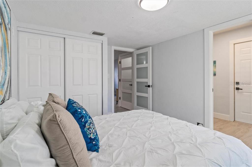 307 161st Avenue Redington Beach, FL 33708 - Photo 8 of 41 a bedroom with a bed and a window