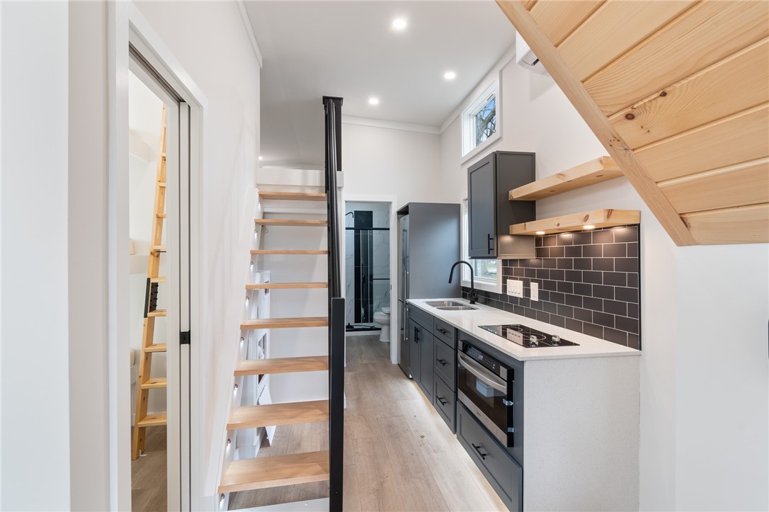 7150 Garner Road Huron, NY 14590 - Photo 11 of 22 The kitchen and loft style sleeping area