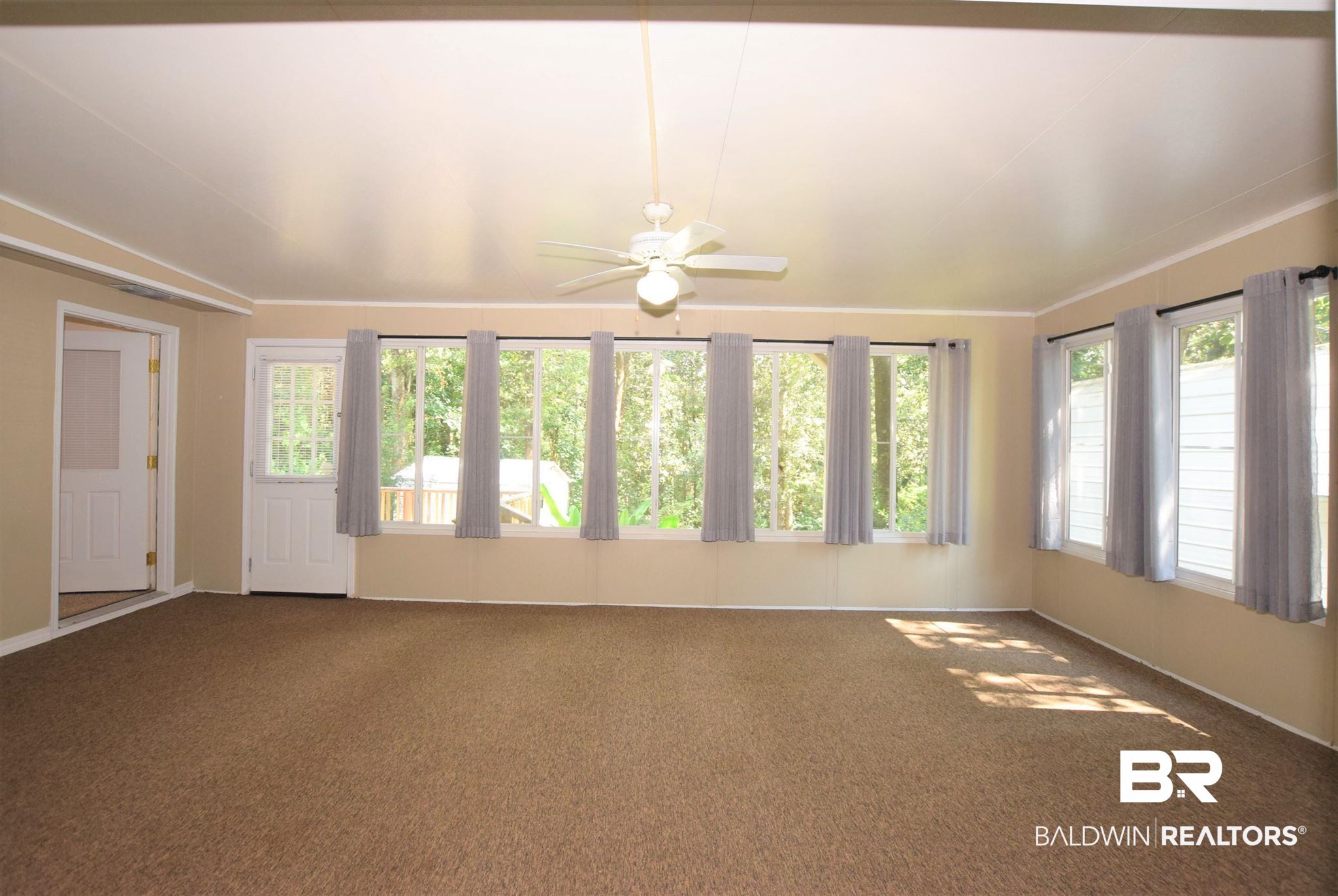 5522 Yucca Drive Mobile, AL 36693 - Photo 12 of 28 Enter the enclosed sun porch off the family room.