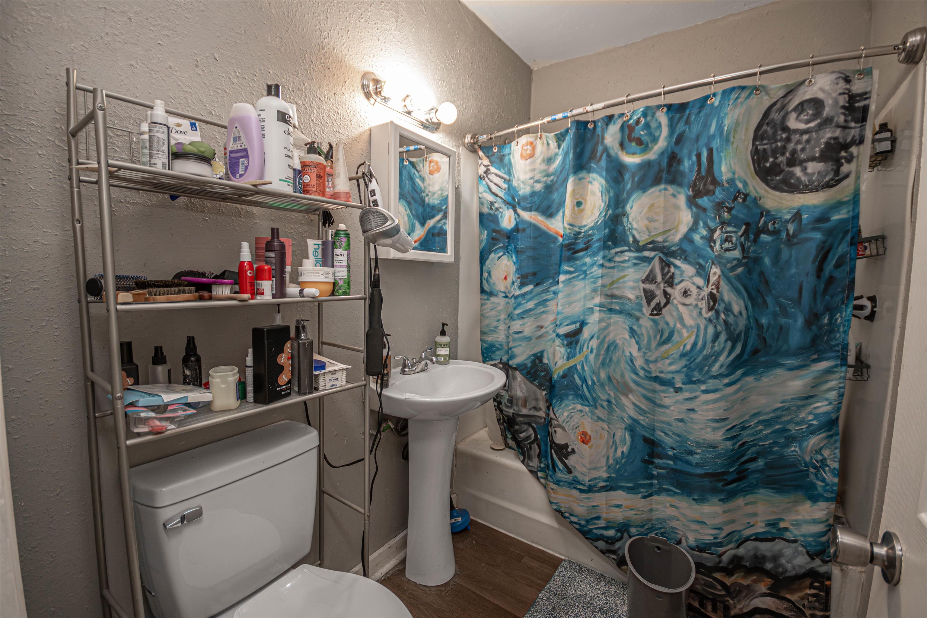 2827 Knight Avenue Rockford, IL 61101 - Photo 11 of 16 a bathroom with a sink and a mirror