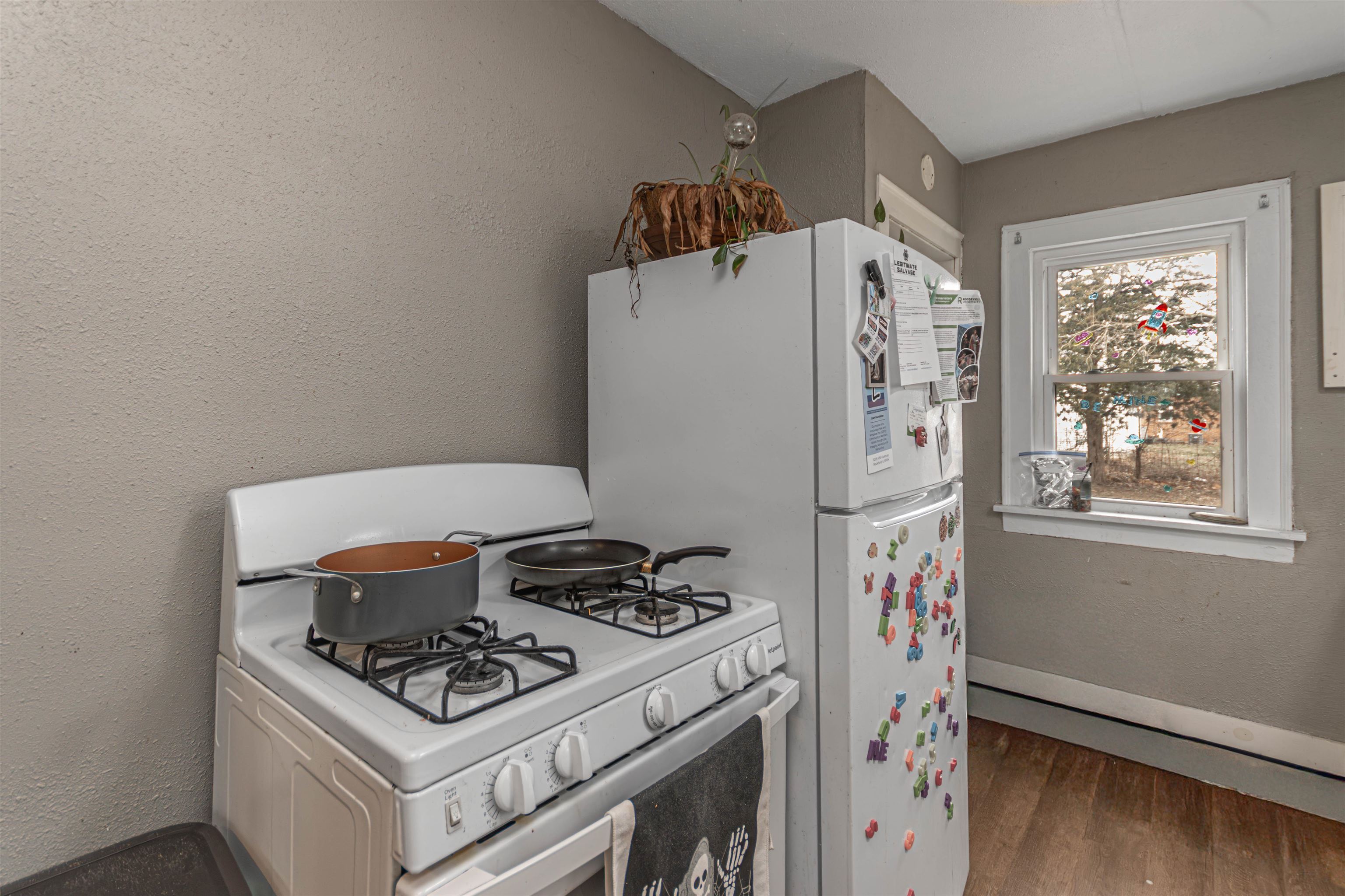 2827 Knight Avenue Rockford, IL 61101 - Photo 6 of 16 a kitchen with a stove and a refrigerator