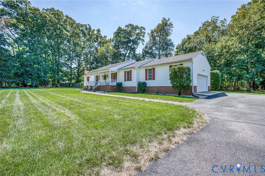 2081 Mill Road Henrico, VA 23231 - Photo 1 of 30 a view of a house with a yard and trees