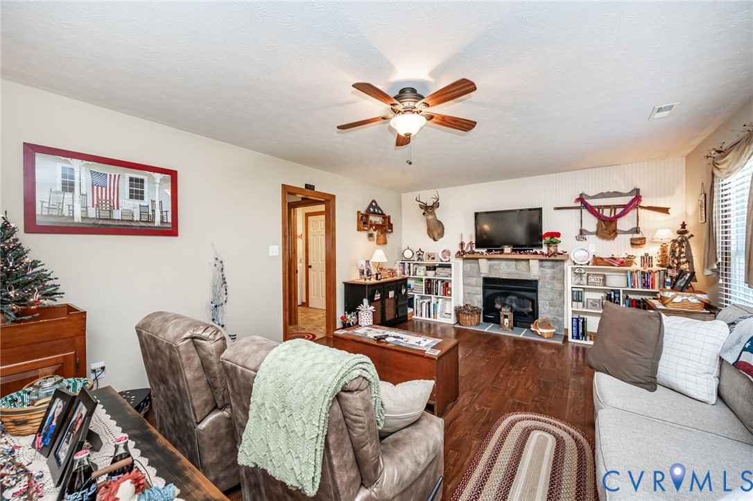 2081 Mill Road Henrico, VA 23231 - Photo 14 of 30 a living room with furniture a fireplace and a flat screen tv