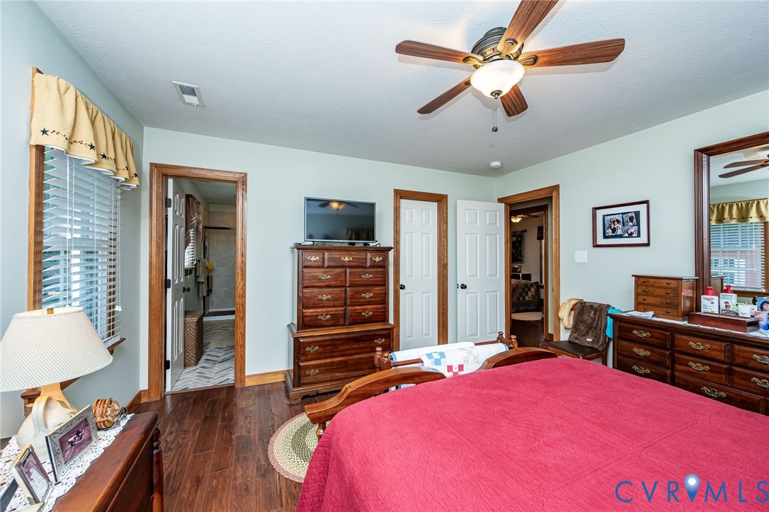 2081 Mill Road Henrico, VA 23231 - Photo 17 of 30 a bedroom with a bed and a chandelier