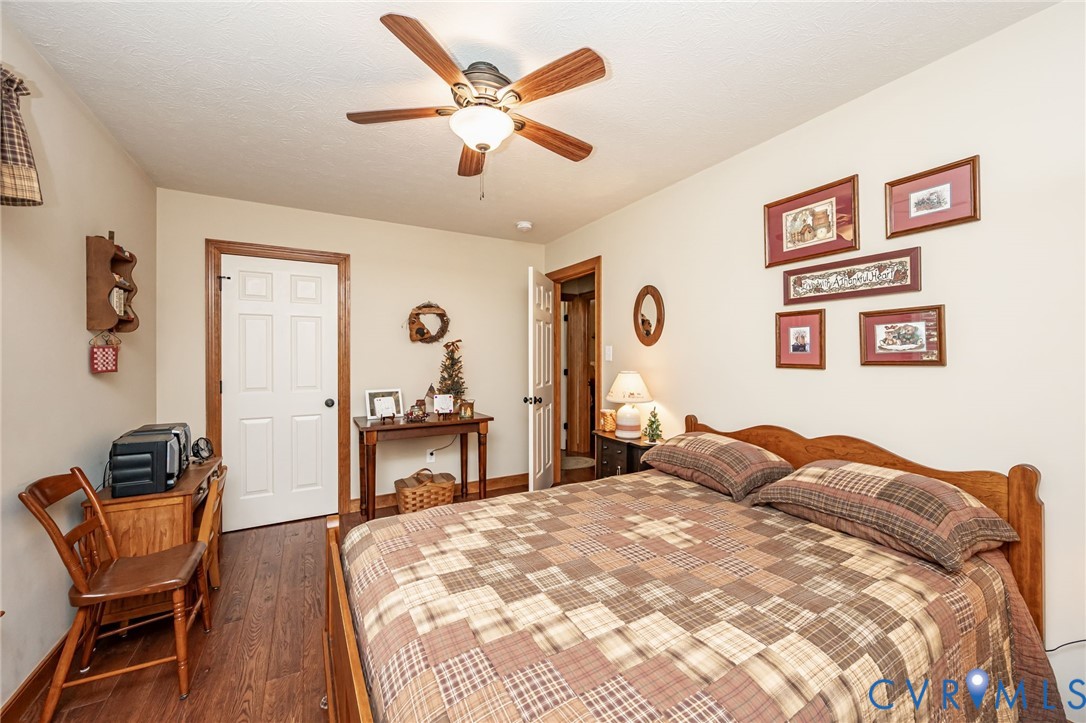 2081 Mill Road Henrico, VA 23231 - Photo 21 of 30 a bedroom with a bed and a chair