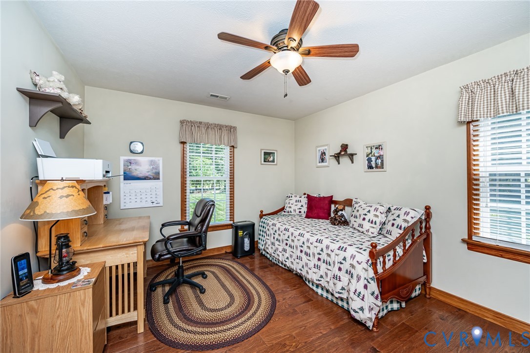 2081 Mill Road Henrico, VA 23231 - Photo 23 of 30 a bedroom with a bed and a chandelier