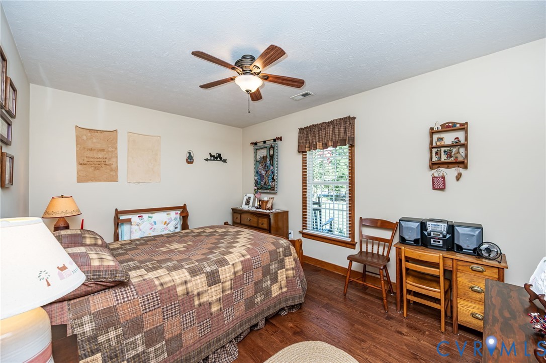 2081 Mill Road Henrico, VA 23231 - Photo 24 of 30 a bedroom with a bed and wooden floor