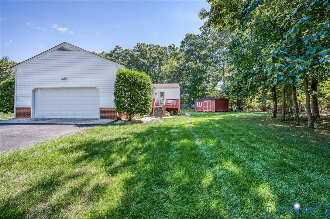 2081 Mill Road Henrico, VA 23231 - Photo 5 of 30 a front view of a house with a yard and garage