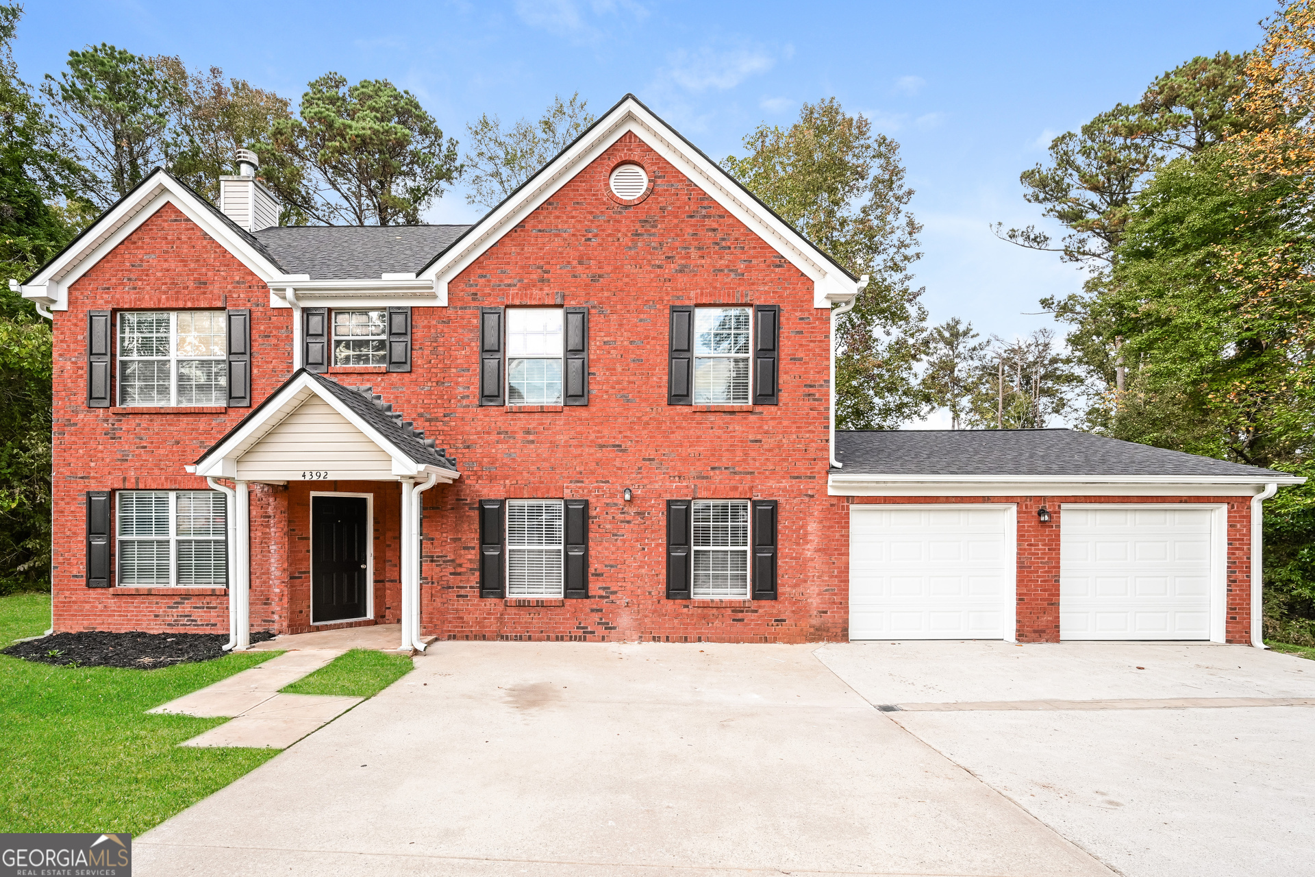 4392 Chester Lane Ellenwood, GA 30294 - Photo 1 of 17 a front view of a house with yard
