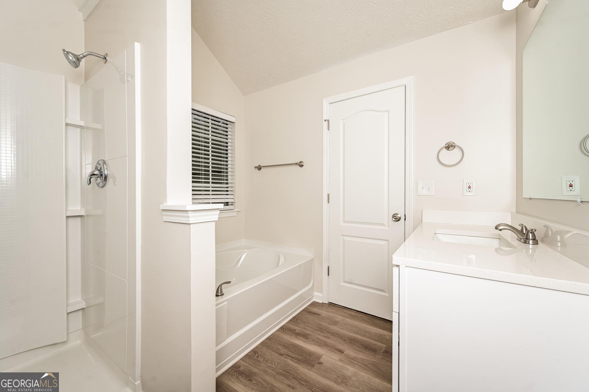4392 Chester Lane Ellenwood, GA 30294 - Photo 12 of 17 a bathroom with a tub sink and mirror