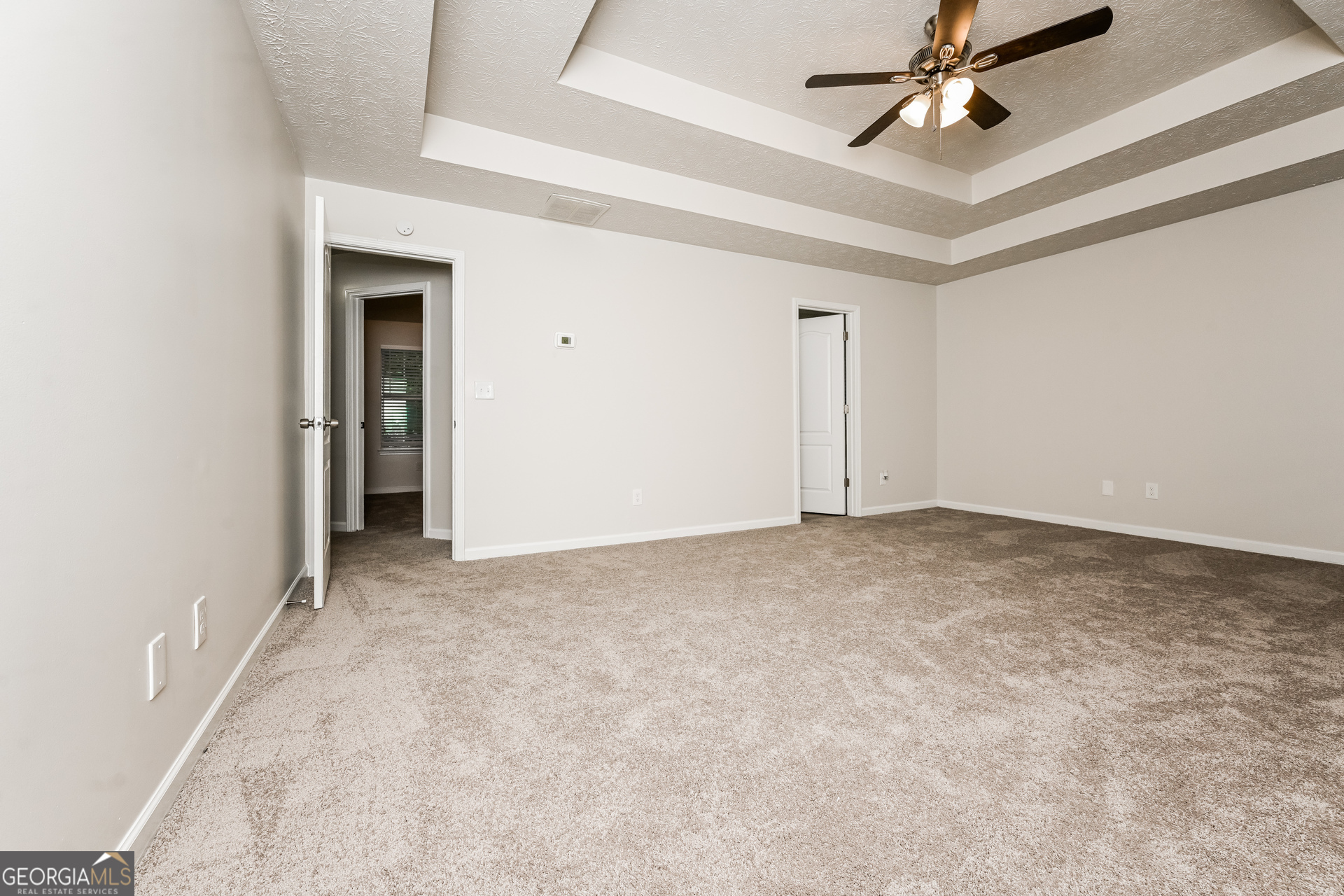 4392 Chester Lane Ellenwood, GA 30294 - Photo 10 of 17 an empty room with a ceiling fan