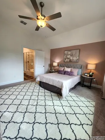 a spacious bathroom with a sink and a mirror