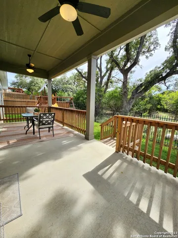 a patio with a table and chairs