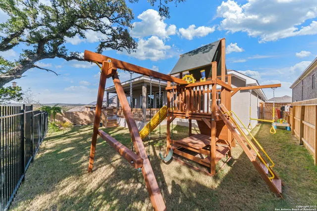 a view of a swimming pool with an outdoor space and seating area