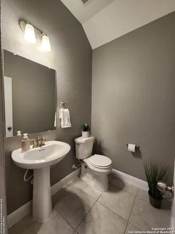 a bathroom with a sink and a toilet