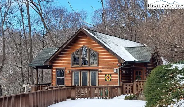 a view of house with a small yard