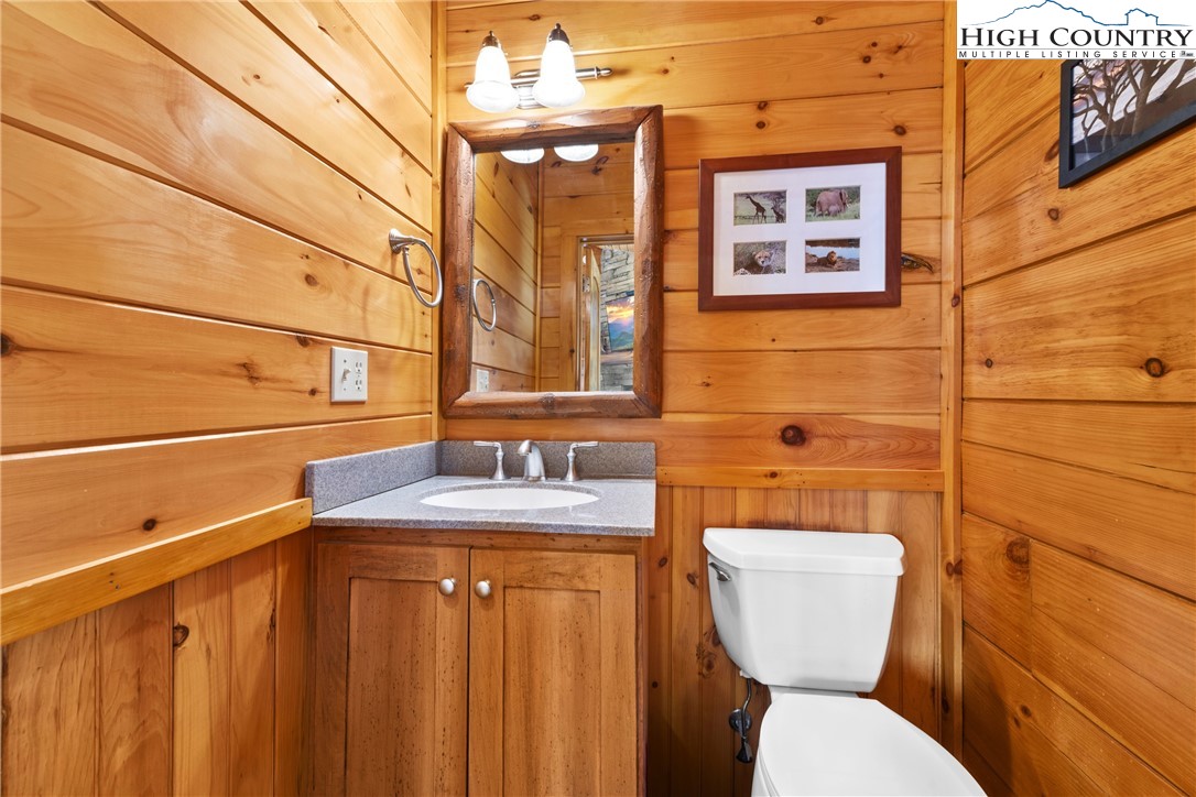 217 Rainbow Ridge Road Zionville, NC 28698 - Photo 12 of 46 a bathroom with a toilet sink and mirror