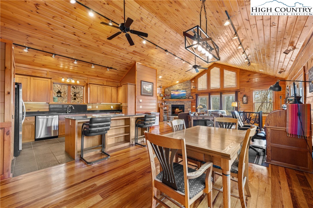 217 Rainbow Ridge Road Zionville, NC 28698 - Photo 21 of 46 a view of a dining room with furniture and wooden floor