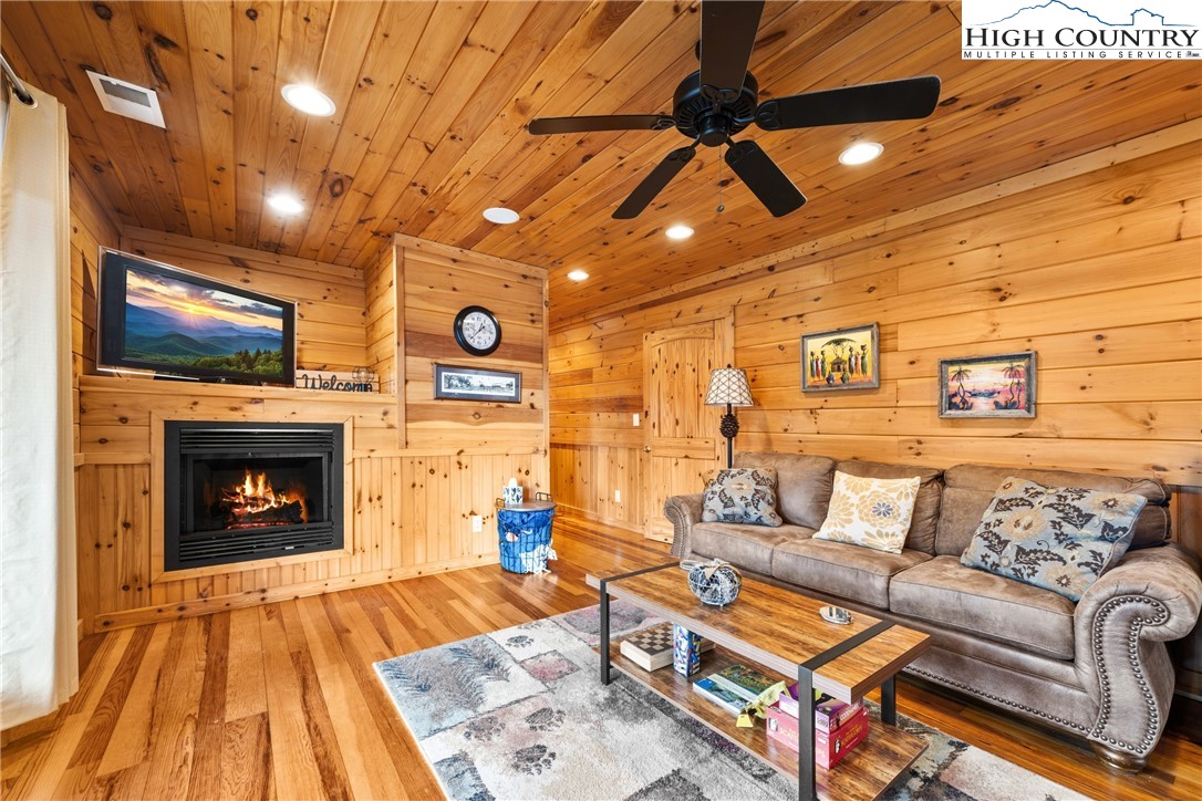217 Rainbow Ridge Road Zionville, NC 28698 - Photo 28 of 46 a living room with furniture and a fireplace