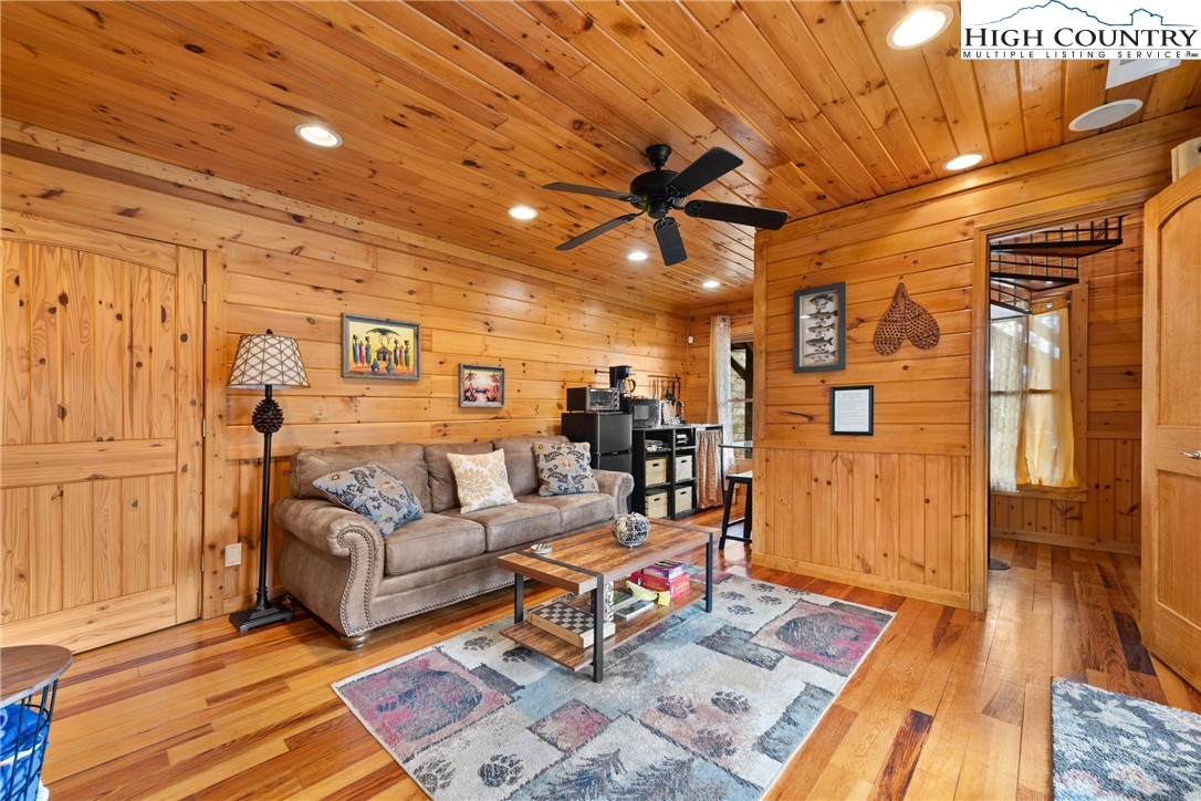 217 Rainbow Ridge Road Zionville, NC 28698 - Photo 29 of 46 a living room with furniture and wooden floor