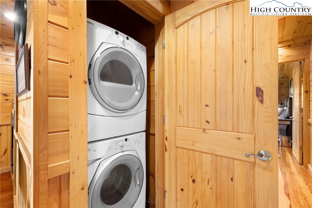 217 Rainbow Ridge Road Zionville, NC 28698 - Photo 31 of 46 a view of a bedroom with washer and dryer
