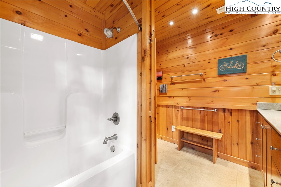 217 Rainbow Ridge Road Zionville, NC 28698 - Photo 34 of 46 a bathroom with a bathtub and shower