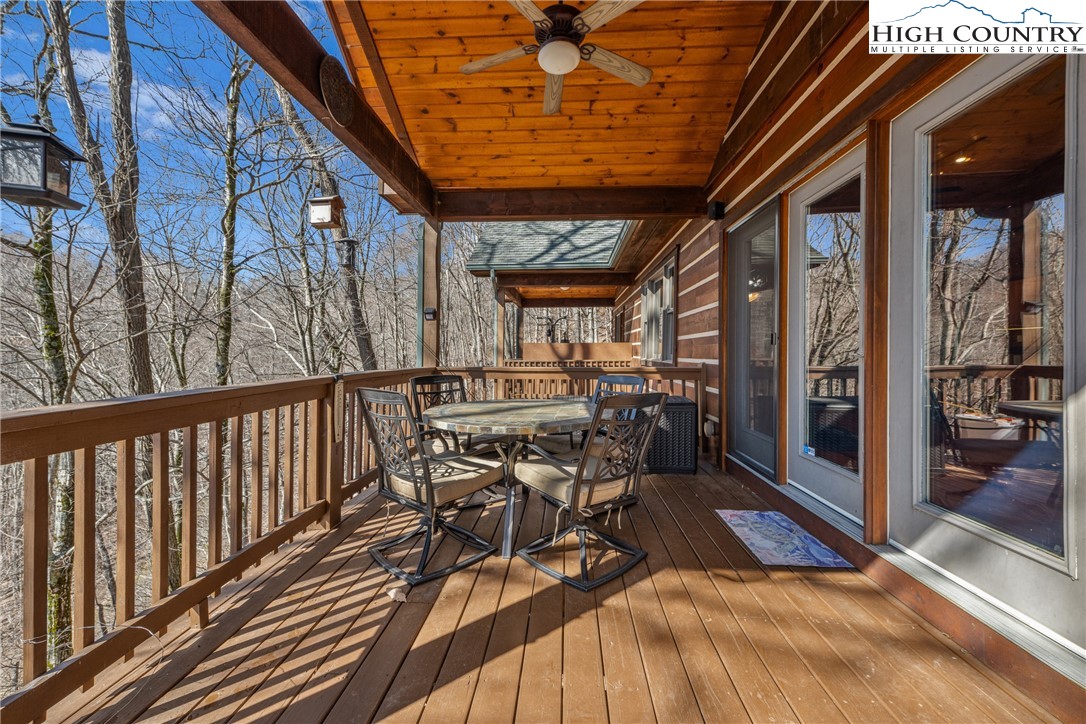 217 Rainbow Ridge Road Zionville, NC 28698 - Photo 9 of 46 a view of a patio with a table and chairs