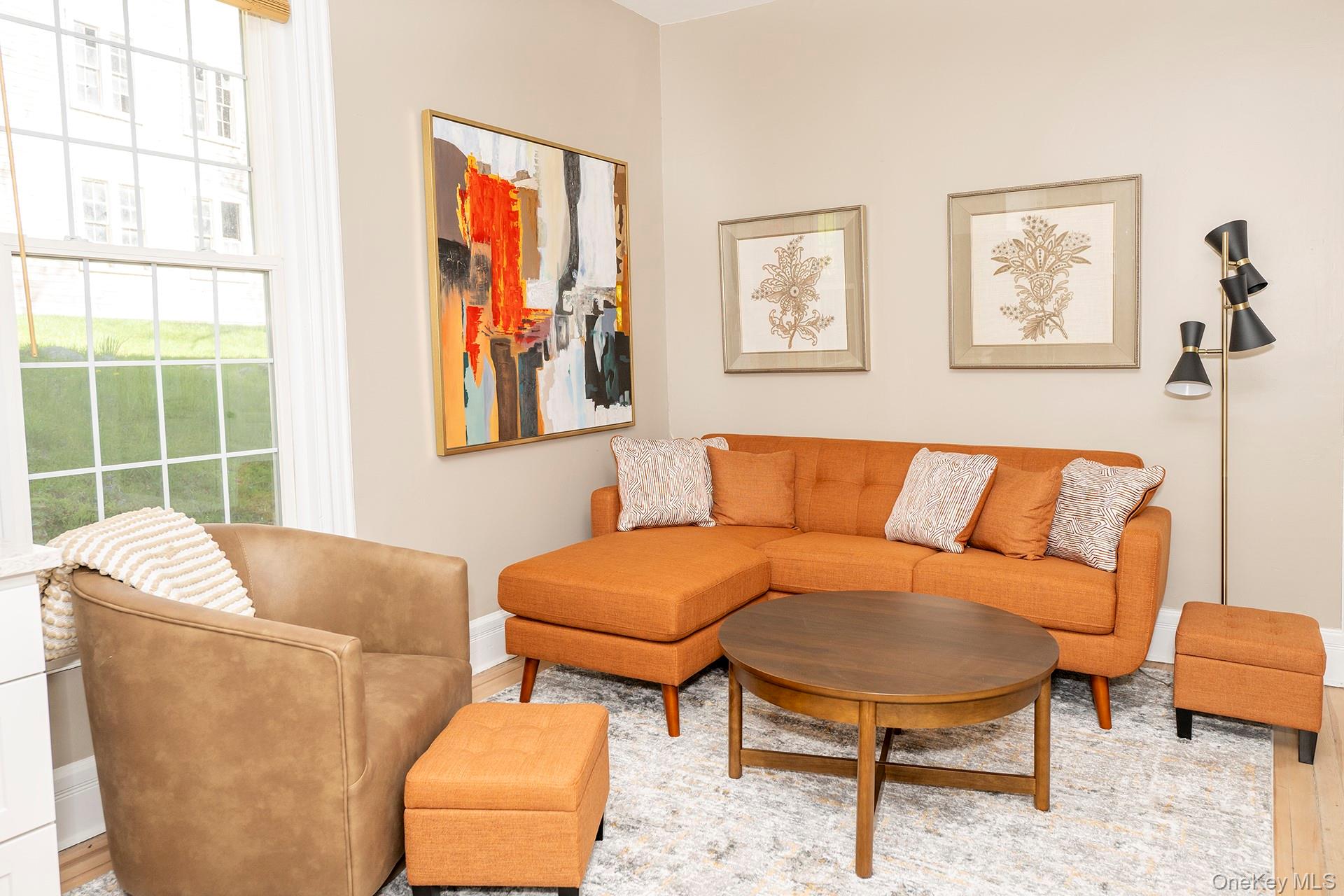 3212 Franklin Avenue, Unit 1ST FLOOR NORHT Millbrook, NY 12545 - Photo 2 of 11 a living room with furniture and a window