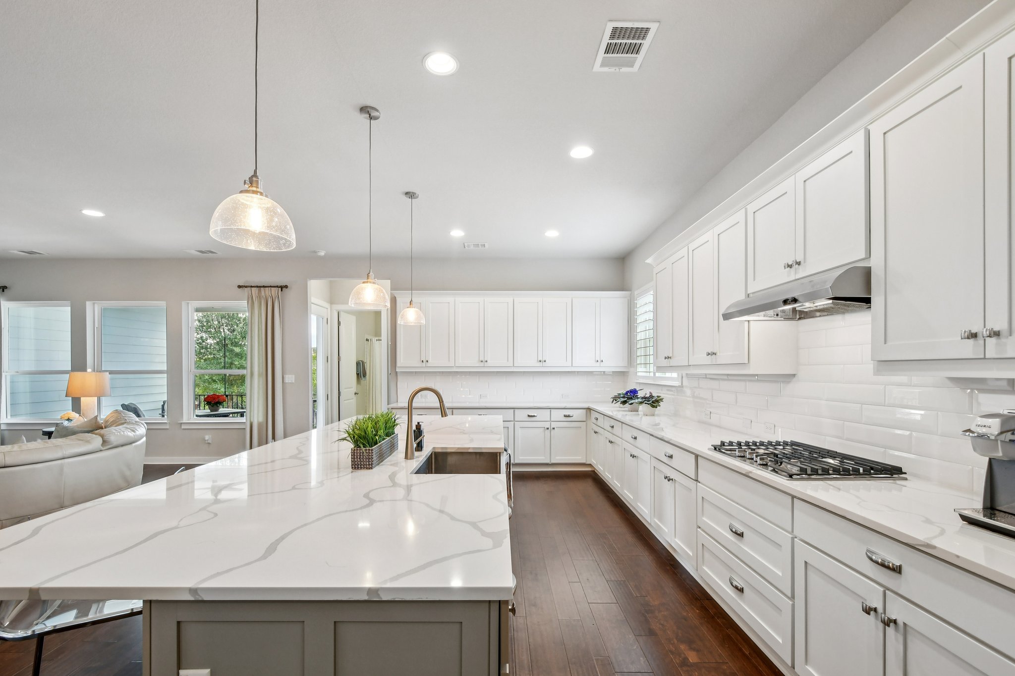 520 Hazy Hills Loop Dripping Springs, TX 78620 - Photo 27 of 27 The heart of this bright, open-concept floorplan centers around a remarkably spacious and modern kitchen. Outfitted with premium fixtures and expansive counter space, this culinary workspace is a chef's dream.
