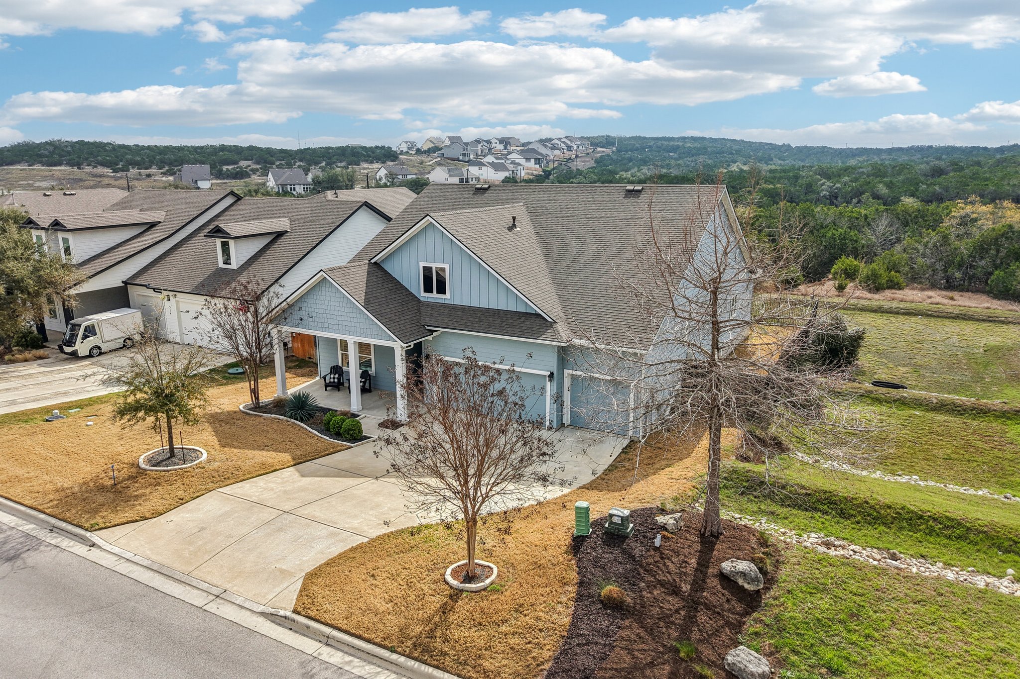 520 Hazy Hills Loop Dripping Springs, TX 78620 - Photo 19 of 27 A beautifully designed residence nestled in the premier Headwaters at Barton Creek community. This stunning 2019 build offers an exceptionally private Hill Country retreat on a highly desirable 0.201-acre dual-greenbelt lot. Experience unmatched natural tranquility with a rare lot placement featuring no immediate neighbors behind or on one side.