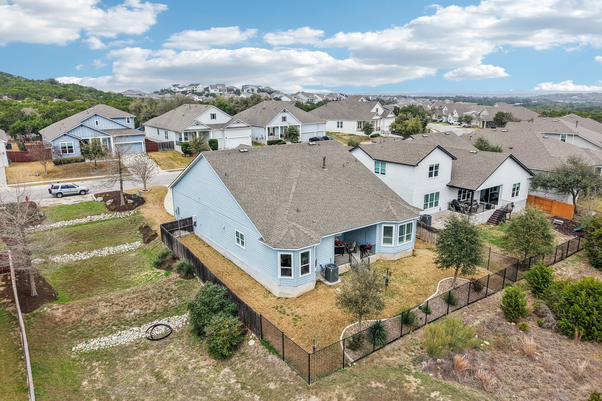 520 Hazy Hills Loop Dripping Springs, TX 78620 - Photo 21 of 27 With no immediate neighbors behind or on one side, the outdoor space maximizes natural tranquility. This dual-greenbelt property seamlessly blends indoor comfort with exceptionally private outdoor living.